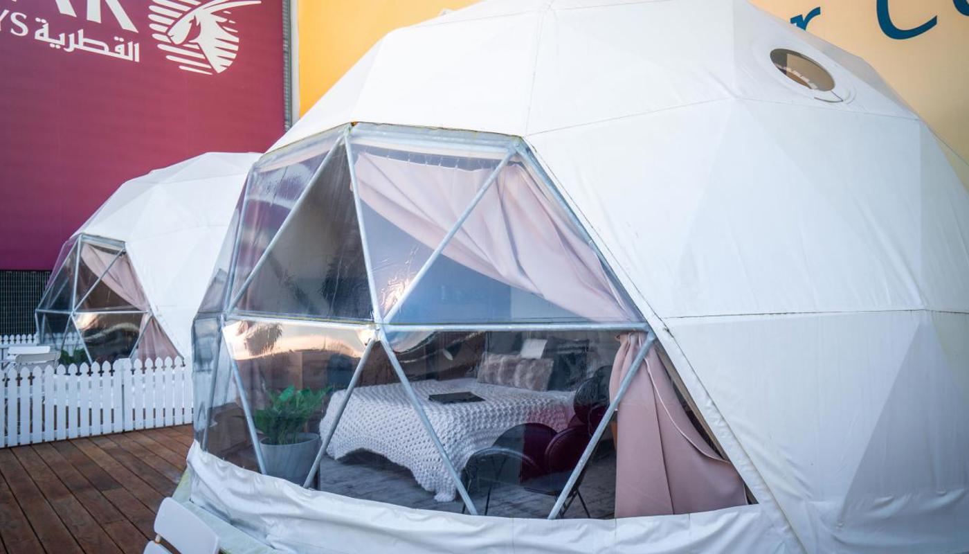 Luxurious light-filled custom domes with private bathrooms.